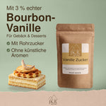 JKR Spices Vanillezucker aus Rohrzucker mit 3 % echter Bourbon-Vanille, neben einem Stück Kuchen.