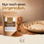 JKR Spices Lebkuchengewürz mit Lebkuchenmännchen neben einem Teller mit Kekskrümeln.