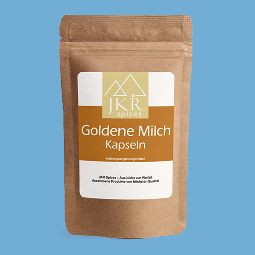 JKR Spices Goldene Milch Kapseln im braunen Doypack mit Etikett auf blauem Hintergrund Vorderseite des Produkts