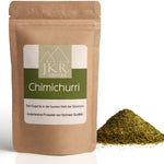 Chimichurri Gewürzmischung im braunen JKR Doypack mit grünem Kräuterpulver daneben – aromatische Kräuter für Grillen und Küche